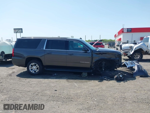 2018 Chevrolet Suburban LT z VIN 1GNSCHKCXJR128787, wystawiony jako IAAI lot #41909965 z przebiegiem 123 020 mil mil oraz . Historia ofert i sprzedaży dostępna na DreamBid. Obrazek 13.