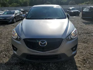 2014 Mazda CX-5 Touring z VIN JM3KE2CY0E0412733, wystawiony jako Copart lot #55803865 z przebiegiem 161 539 mil mil oraz Szkoda całkowita • Salvage title. Historia ofert i sprzedaży dostępna na DreamBid. Obrazek 5.