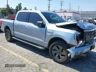 2022 Ford F-150 Lightning Pro z VIN 1FT6W1EV0NWG05515, wystawiony jako IAAI lot #42343136 z przebiegiem 49 544 mil mil oraz . Historia ofert i sprzedaży dostępna na DreamBid. Obrazek 1.
