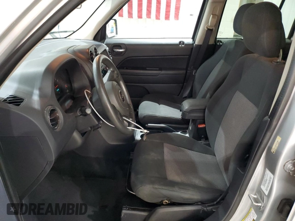 2012 Jeep Patriot Sport with VIN 1C4NJPBA4CD724577, listed as a Copart auction lot 55597375 with 155,528 mi miles and Salvage Title. Bid and sale history available at DreamBid. Image 7.