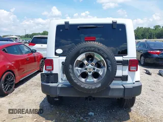 2018 Jeep Wrangler Unlimited Sahara with VIN 1C4BJWEG3JL805263, listed as a IAAI auction lot 42593276 with 96,489 mi miles and . Bid and sale history available at DreamBid. Image 16.