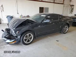 2007 Ford Mustang Deluxe with VIN 1ZVFT80N975220050, listed as a Copart auction lot 59152665 with 165,146 mi miles and Salvage title. Bid and sale history available at DreamBid. Image 1.