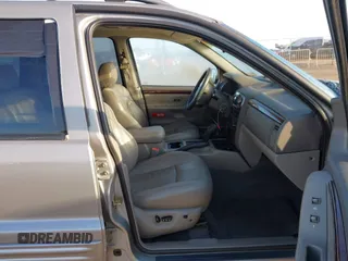 2001 Jeep Grand Cherokee Limited with VIN 1J4GW58N61C670589, listed as a IAAI auction lot 41817712 with 185,905 mi miles. Bid and sale history available at carsss.com. Image 5.