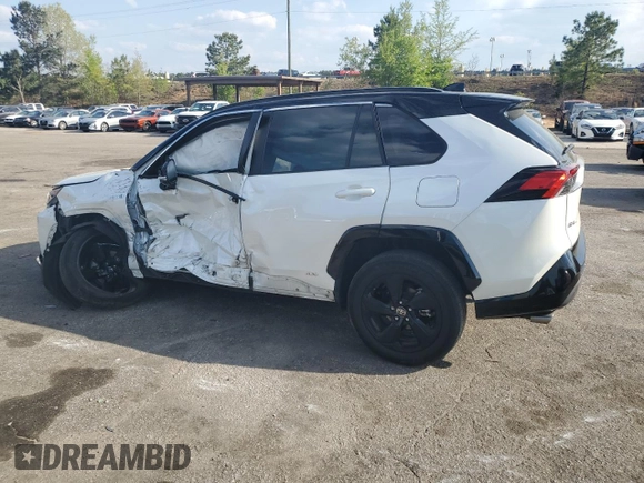 2021 Toyota RAV4 Hybrid XSE with VIN 2T3E6RFV1MW028094, listed as a Copart auction lot 52596615 with 68,497 mi miles and Salvage title. Bid and sale history available at DreamBid. Image 2.