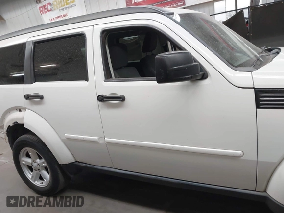 2007 Dodge Nitro SLT with VIN 1D8GU58K97W583408, listed as a IAAI auction lot 41653696 with 124,449 mi miles. Bid and sale history available at carsss.com. Image 13.