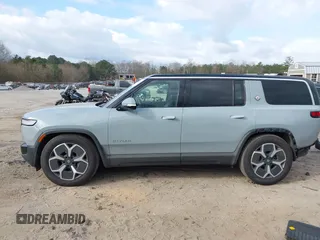 2024 Rivian R1S Adventure with VIN 7PDSGBBA1RN040036, listed as a IAAI auction lot 41694635 with 13,855 mi miles. Bid and sale history available at carsss.com. Image 15.