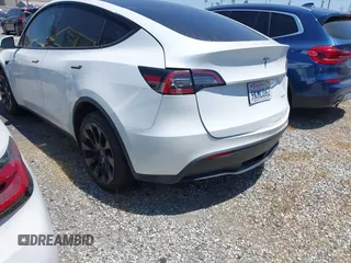 2022 Tesla Model Y Long Range with VIN 7SAYGDEE8NF480939, listed as a IAAI auction lot 41808863 with 62,607 mi miles and . Bid and sale history available at carsss.com. Image 3.