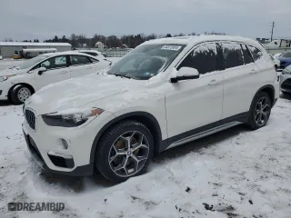 2019 BMW X1 xDrive28i with VIN WBXHT3C54K5L91407, listed as a Copart auction lot 84875904 with 97,304 mi miles and Salvage Title. Bid and sale history available at carsss.com. Image 1.