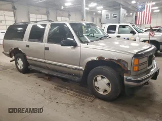 1999 GMC Suburban z VIN 3GKFK16R4XG540882, wystawiony jako Copart lot #80780884 z przebiegiem 209 819 mil mil oraz Czysty tytuł • Clean title. Historia ofert i sprzedaży dostępna na DreamBid. Obrazek 4.