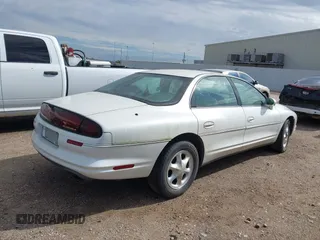 1996 Oldsmobile Aurora z VIN 1G3GR62C1T4121552, wystawiony jako IAAI lot #40766504 z przebiegiem 75 434 mil mil oraz . Historia ofert i sprzedaży dostępna na DreamBid. Obrazek 4.
