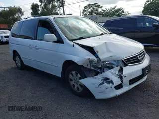 2004 Honda Odyssey EX-L with VIN 5FNRL18924B064040, listed as a IAAI auction lot 41350306 with 130,803 mi miles and . Bid and sale history available at DreamBid. Image 1.
