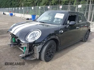 2015 MINI Hardtop 4 Door with VIN WMWXS5C58FT833420, listed as a IAAI auction lot 42560244 with 115,446 mi miles and . Bid and sale history available at DreamBid. Image 2.