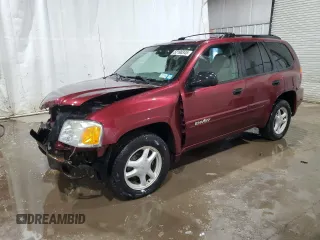 2004 GMC Envoy SLT with VIN 1GKDS13S242412076, listed as a Copart auction lot 52190345 with 148,642 mi miles and Salvage Title. Bid and sale history available at carsss.com. Image 1.