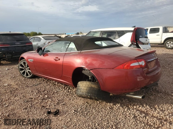 2013 Jaguar XK with VIN SAJWA4GB0DLB50530, listed as a Copart auction lot 82715724 with 24,634 mi miles and Salvage Title. Bid and sale history available at carsss.com. Image 2.