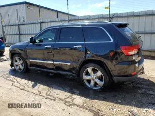 2012 Jeep Grand Cherokee Overland with VIN 1C4RJECTXCC227769, listed as a Copart auction lot 68760174 with 144,537 mi miles and Salvage Title. Bid and sale history available at carsss.com. Image 2.