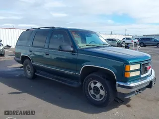 1999 GMC Yukon with VIN 1GKEK13R3XJ717999, listed as a IAAI auction lot 41870187 with 179,855 mi miles. Bid and sale history available at carsss.com. Image 1.