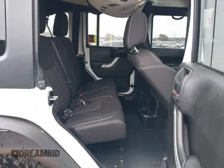 2014 Jeep Wrangler Unlimited Rubicon with VIN 1C4BJWFGXEL283929, listed as a IAAI auction lot 41812052 with 137,790 mi miles and . Bid and sale history available at DreamBid. Image 8.