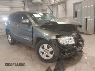 2012 Jeep Grand Cherokee Laredo with VIN 1C4RJFAG3CC209142, listed as a IAAI auction lot 41978296 with 201,796 mi miles. Bid and sale history available at carsss.com. Image 1.