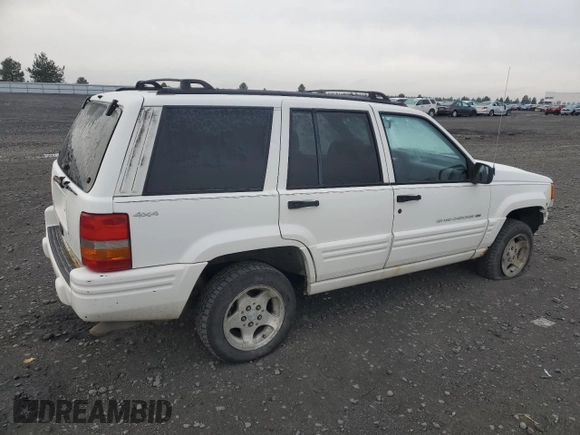1998 Jeep Grand Cherokee Laredo with VIN 1J4GZ48S1WC165851, listed as a Copart auction lot 84110044 with 306,484 mi miles and Salvage Title. Bid and sale history available at carsss.com. Image 3.
