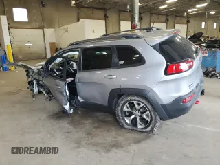 2014 Jeep Cherokee Trailhawk with VIN 1C4PJMBSXEW213981, listed as a Copart auction lot 60440495 with 136,612 mi miles and Salvage title. Bid and sale history available at DreamBid. Image 2.