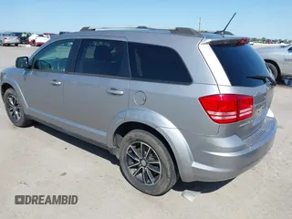 2017 Dodge Journey SE z VIN 3C4PDCAB1HT573511, wystawiony jako IAAI lot #41984865 z przebiegiem 128 721 mil mil oraz . Historia ofert i sprzedaży dostępna na DreamBid. Obrazek 3.
