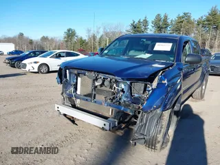 2014 Toyota Tacoma with VIN 3TMLU4EN5EM140028, listed as a IAAI auction lot 40965372 with 94,372 mi miles and . Bid and sale history available at DreamBid. Image 6.