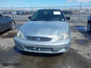1999 Honda Civic VP with VIN 2HGEJ6615XH528453, listed as a IAAI auction lot 41655363 with 163,816 mi miles. Bid and sale history available at carsss.com. Image 6.