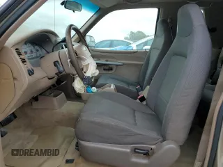 2002 Ford Explorer Sport Value with VIN 1FMYU60EX2UC31677, listed as a Copart auction lot 46415785 with 104,684 mi miles and Salvage title. Bid and sale history available at DreamBid. Image 7.