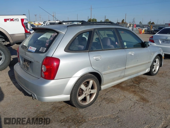 2003 Mazda Protege with VIN JM1BJ245131122498, listed as a IAAI auction lot 41990488 with 170,880 mi miles and . Bid and sale history available at DreamBid. Image 4.