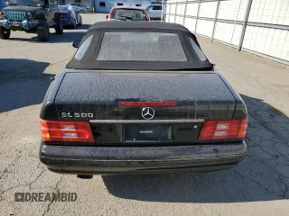 1999 Mercedes-Benz SL-Class with VIN WDBFA68F1XF184891, listed as a Copart auction lot 77082284 with 96,379 mi miles and Salvage Title. Bid and sale history available at carsss.com. Image 6.
