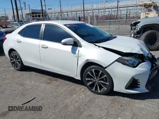2017 Toyota Corolla L z VIN 5YFBURHE2HP726560, wystawiony jako IAAI lot #41837010 z przebiegiem 104 207 mil mil oraz . Historia ofert i sprzedaży dostępna na DreamBid. Obrazek 1.