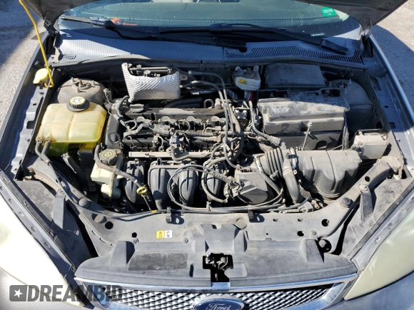 2007 Ford Focus S z VIN 1FAHP34N77W192231, wystawiony jako Copart lot #59020505 z przebiegiem 99 284 mil mil oraz Szkoda całkowita • Salvage title. Historia ofert i sprzedaży dostępna na DreamBid. Obrazek 11.