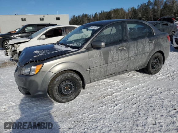 2011 Kia Rio with VIN KNADH4B32B6915325, listed as a Copart auction lot 86824074 with 167,410 mi miles and Salvage Title. Bid and sale history available at DreamBid. Image 1.