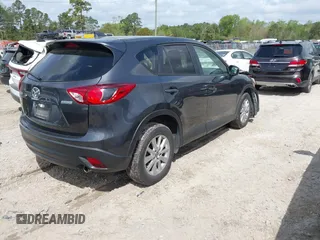 2016 Mazda CX-5 Touring with VIN JM3KE2CYXG0647921, listed as a IAAI auction lot 41948068 with 133,733 mi miles and . Bid and sale history available at DreamBid. Image 4.
