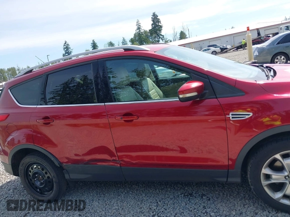 2015 Ford Escape Titanium with VIN 1FMCU9J93FUB28037, listed as a IAAI auction lot 42432345 with 133,242 mi miles and . Bid and sale history available at DreamBid. Image 13.