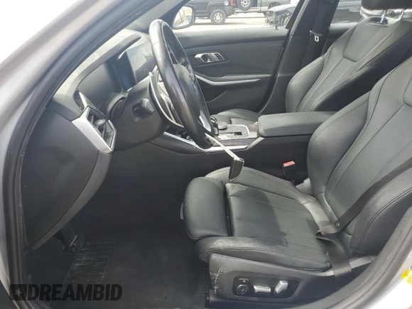 2020 BMW 3 Series 330i with VIN WBA5R1C07LFH40014, listed as a Copart auction lot 60656645 with 76,392 mi miles and Clean title. Bid and sale history available at DreamBid. Image 7.