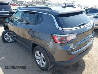 2019 Jeep Compass Latitude with VIN 3C4NJDBB8KT729491, listed as a IAAI auction lot 42489691 with 73,022 mi miles and . Bid and sale history available at DreamBid. Image 3.