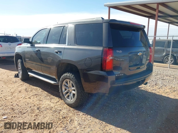 2015 Chevrolet Tahoe LS with VIN 1GNSCAKC9FR122896, listed as a IAAI auction lot 42239812 with 164,888 mi miles and . Bid and sale history available at DreamBid. Image 3.