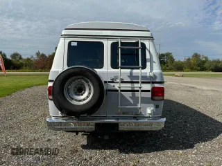 1990 GMC Vandura z VIN 1GDEG25K5L7522525, wystawiony jako Copart lot #75007594 z przebiegiem 91 857 mil mil oraz Szkody całkowita. Historia ofert i sprzedaży dostępna na DreamBid. Obrazek 7.