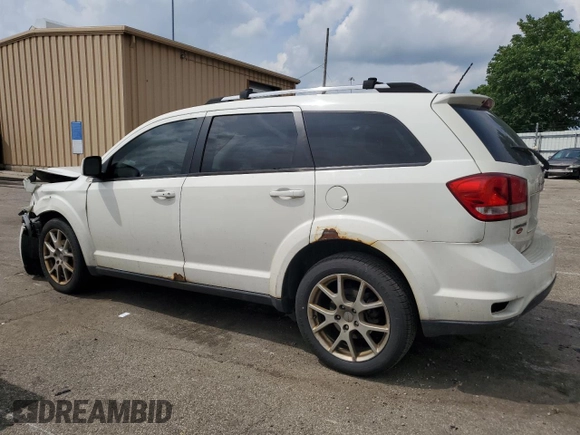 2012 Dodge Journey SXT with VIN 3C4PDCCG4CT243492, listed as a Copart auction lot 59908485 with 319,175 mi miles and Salvage title. Bid and sale history available at DreamBid. Image 2.