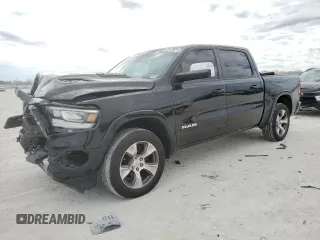 2020 Ram 1500 Laramie with VIN 1C6SRFJM4LN392322, listed as a Copart auction lot 89150615 with 76,893 mi miles and Salvage title. Bid and sale history available at DreamBid. Image 1.