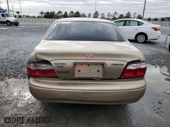 2001 Mazda 626 LX z VIN 1YVGF22CX15238033, wystawiony jako Copart lot #47245985 z przebiegiem 91 735 mil mil oraz Szkoda całkowita • Salvage title. Historia ofert i sprzedaży dostępna na DreamBid. Obrazek 6.