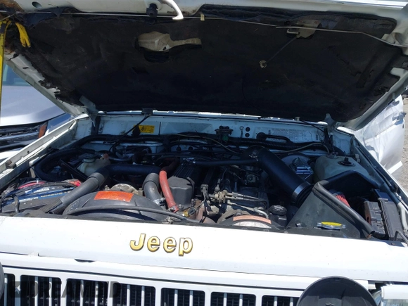 1991 Jeep Cherokee Country z VIN 1J4FJ78S7ML632675, wystawiony jako IAAI lot #42283175 z przebiegiem 116 062 mil mil oraz . Historia ofert i sprzedaży dostępna na DreamBid. Obrazek 10.