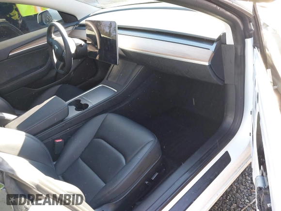 2023 Tesla Model 3 z VIN 5YJ3E1EA0PF611244, wystawiony jako IAAI lot #41455102 z przebiegiem 21 867 mil mil oraz . Historia ofert i sprzedaży dostępna na DreamBid. Obrazek 5.