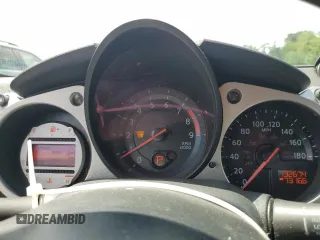 2009 Nissan 370Z z VIN JN1AZ44E69M409779, wystawiony jako Copart lot #55615955 z przebiegiem 132 674 mil mil oraz Szkoda całkowita • Salvage title. Historia ofert i sprzedaży dostępna na DreamBid. Obrazek 9.