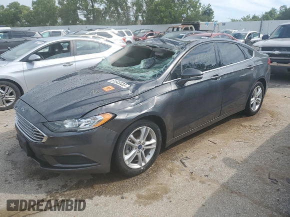 2018 Ford Fusion SE z VIN 3FA6P0H78JR261102, wystawiony jako Copart lot #69963883 z przebiegiem 120 068 mil mil oraz Czysty tytuł • Clean title. Historia ofert i sprzedaży dostępna na DreamBid. Obrazek 1.