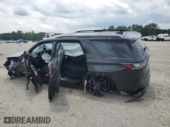 2021 Chevrolet Traverse Premier with VIN 1GNERKKW2MJ262862, listed as a Copart auction lot 58779765 with 76,927 mi miles and Salvage title. Bid and sale history available at DreamBid. Image 2.