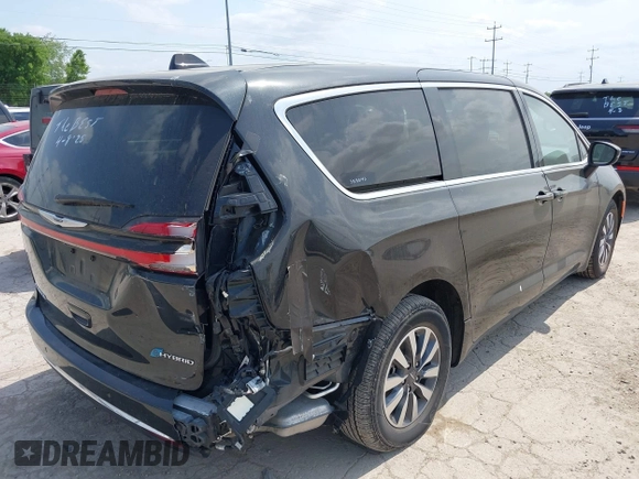2023 Chrysler Pacifica Hybrid Touring L with VIN 2C4RC1L75PR592251, listed as a IAAI auction lot 42037873 with 44,428 mi miles and . Bid and sale history available at DreamBid. Image 4.