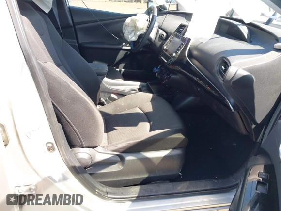 2021 Toyota Prius L Eco with VIN JTDKAMFUXM3144991, listed as a IAAI auction lot 42147025 with 106,466 mi miles and . Bid and sale history available at DreamBid. Image 5.