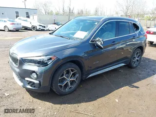 2016 BMW X1 xDrive28i with VIN WBXHT3C35GP886094, listed as a IAAI auction lot 42009639 with 61,739 mi miles. Bid and sale history available at carsss.com. Image 19.